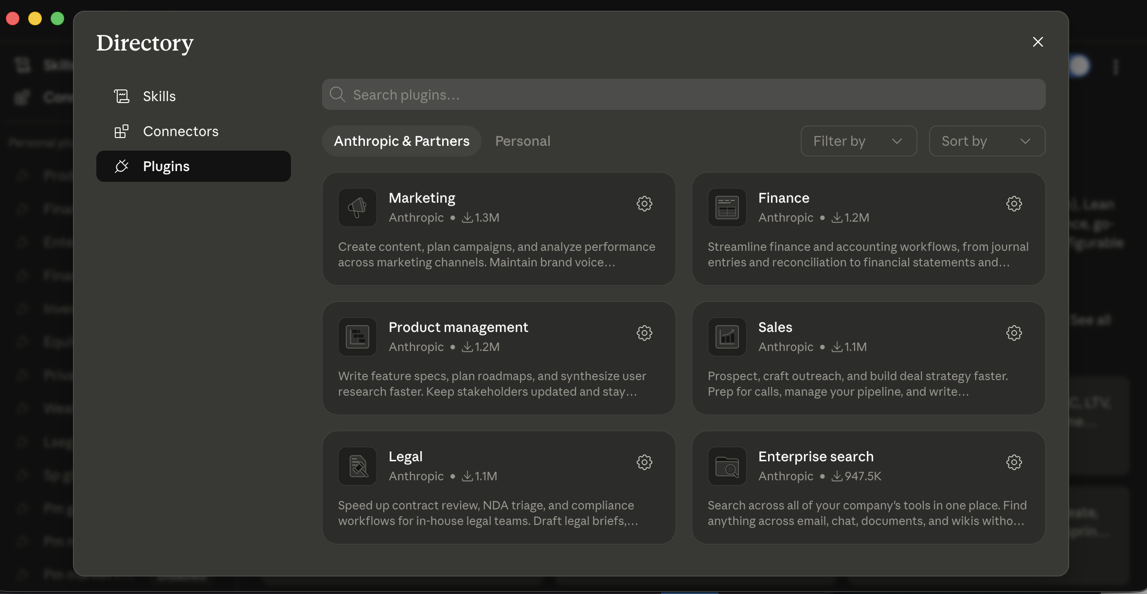 Cowork's Plugins Directory modal. Left sidebar: Skills / Connectors / Plugins (selected). Top: search bar "Search plugins..." with tabs "Anthropic &amp; Partners" (selected) and "Personal", plus "Filter by" and "Sort by" dropdowns. Grid of plugin cards, each showing a name, the publisher (Anthropic), and a download count: Marketing (Anthropic • ↓1.1M, "Create content, plan campaigns, and analyze performance across marketing channels. Maintain brand voice..."), Finance (Anthropic • ↓1.2M, "Streamline finance and accounting workflows, from journal entries and reconciliation to financial statements and..."), Product management (Anthropic • ↓1.2M, "Write feature specs, plan roadmaps, and synthesize user research faster. Keep stakeholders updated and stay..."), Sales (Anthropic • ↓1.2M, "Prospect, craft outreach, and build deal strategy faster. Prep for calls, manage your pipeline, and write..."), Legal (Anthropic • ↓947.5K, "Speed up contract review, NDA triage, and compliance workflows for in-house legal teams. Draft legal briefs..."), Enterprise search (Anthropic • ↓647.5K, "Search across all of your company's tools in one place. Find anything across email, chat, documents, and wikis with..."). Each card has a gear icon for settings